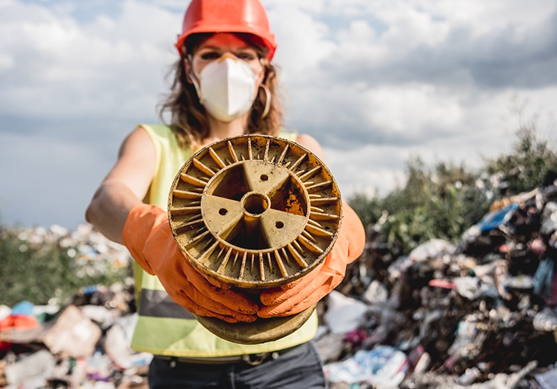 woman volunteer helps clean the field of nuclear
